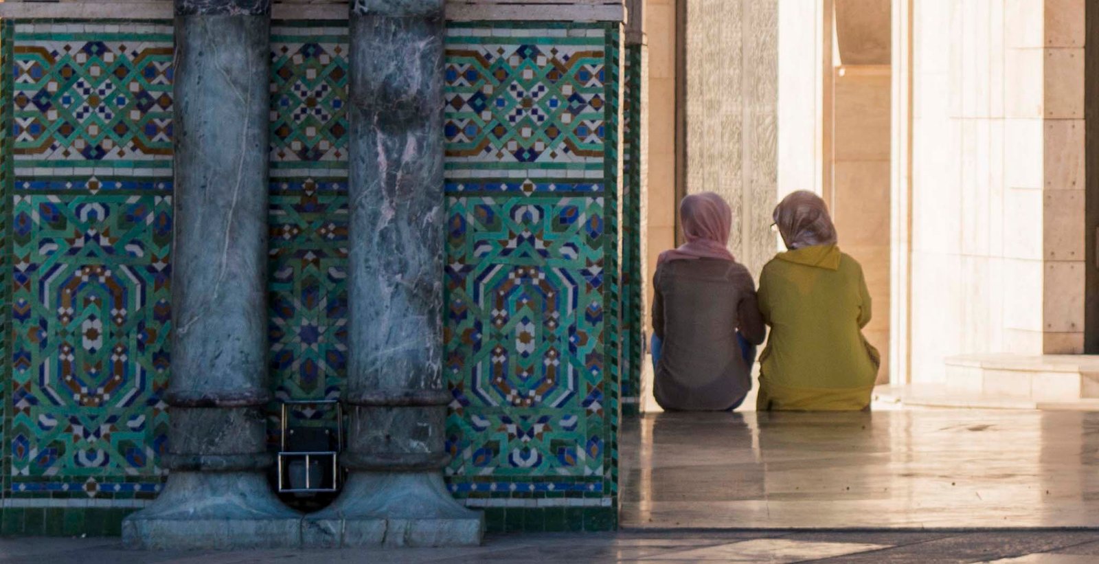 two women chatting away the evening on the steps on Hassan 2 mosque