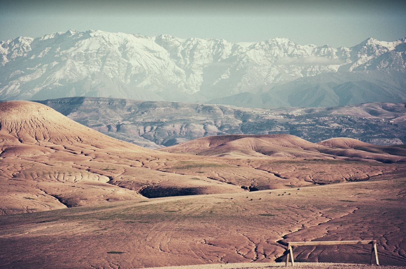 Aerial view of Agafay Desert showing vast rocky terrain and winding paths