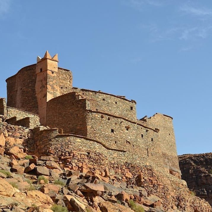 Igoudar A fortified granary carved into the mountainside, used as part of the Igoudar banking system in Morocco.