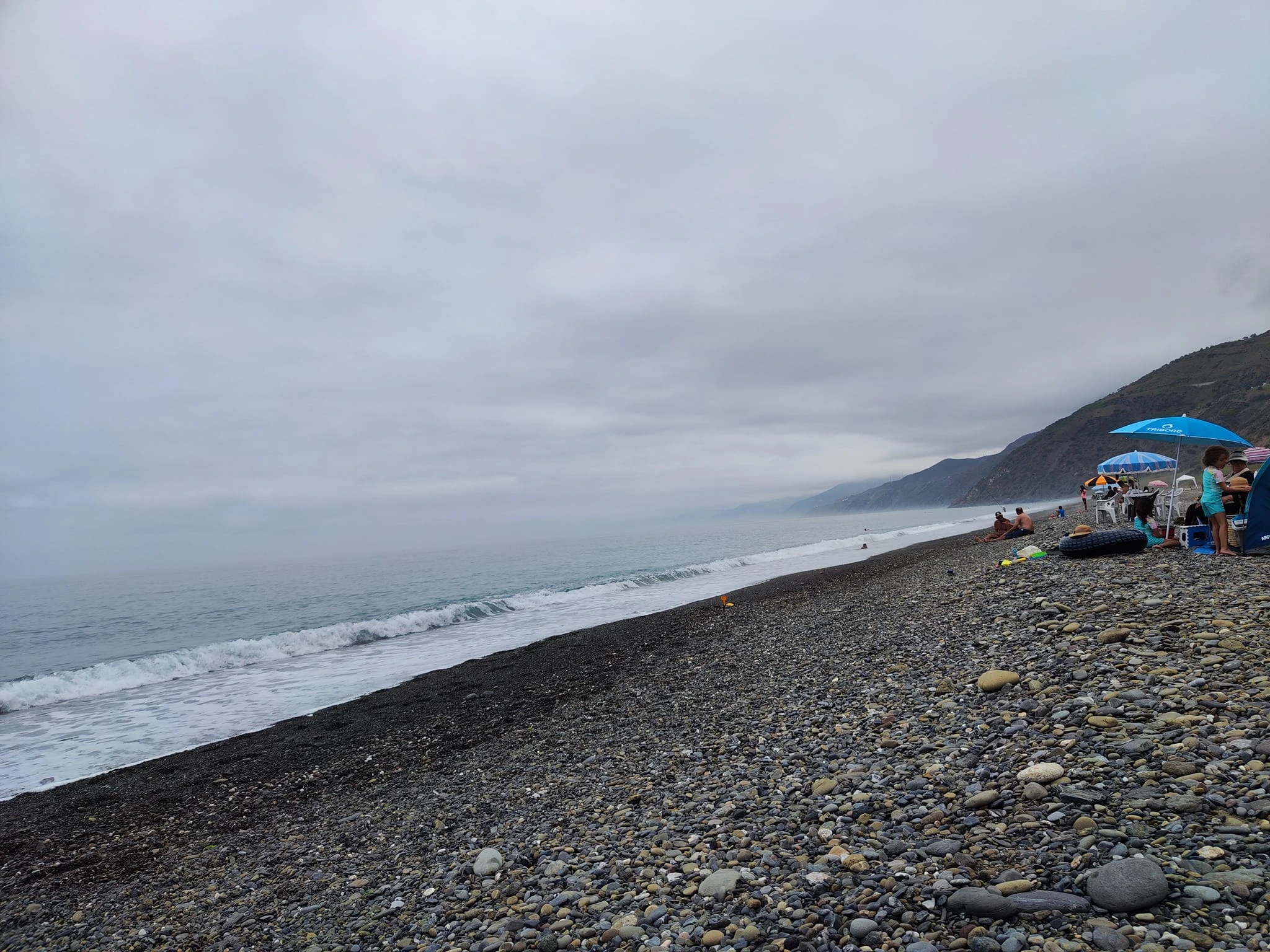Discover Jnan Nich Beach, a hidden black sand paradise in northern Morocco. Crystal clear waters, dramatic cliffs, and authentic Berber culture await.
